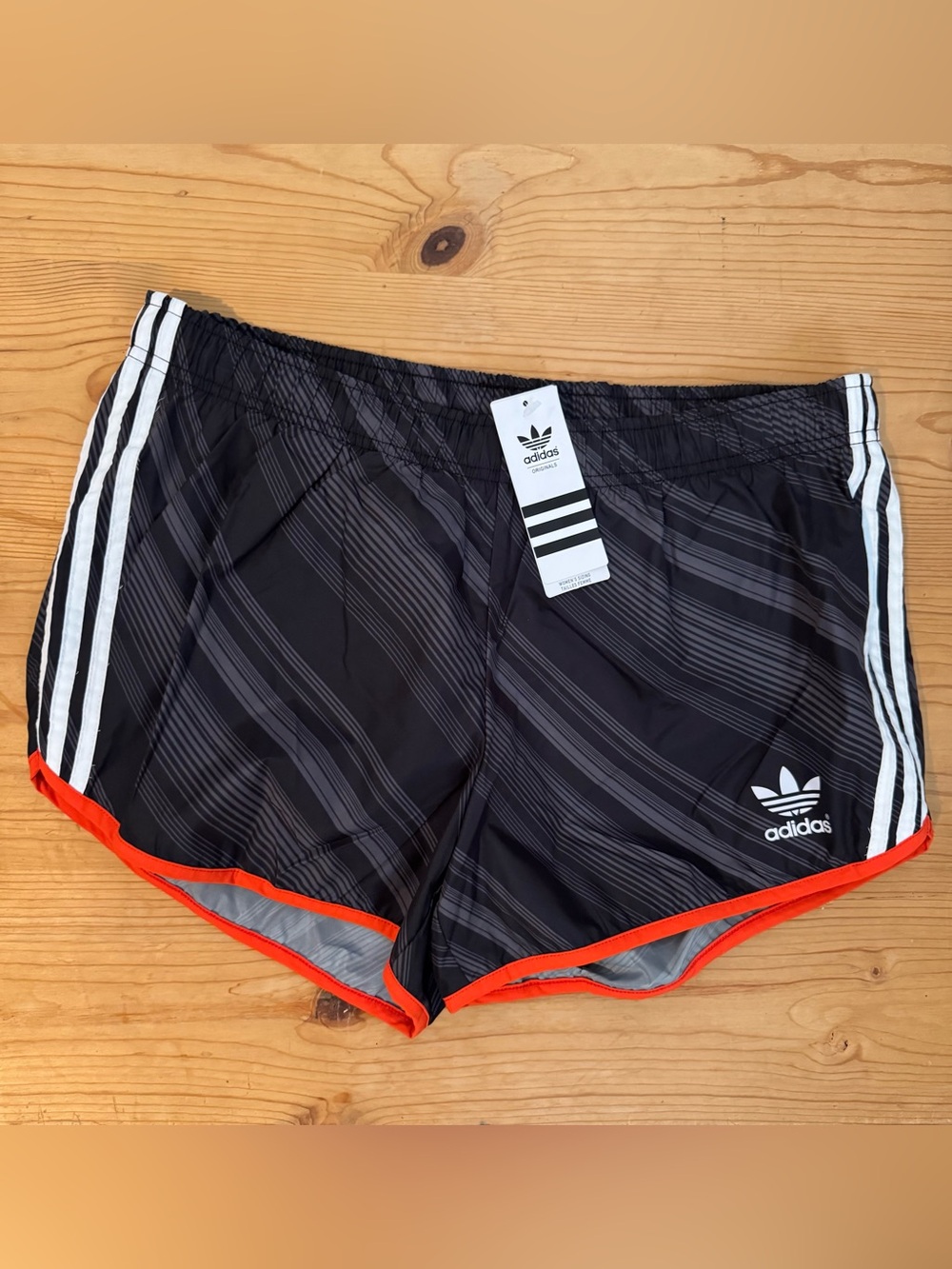 ADIDAS women’s Black Athletic Shorts with Orange Trim
